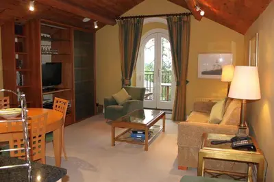 a living room with a couch and a table at Catbells in Applethwaite