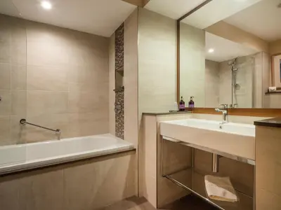 a bathroom with a sink and a bath tub at Brackenburn in Applethwaite