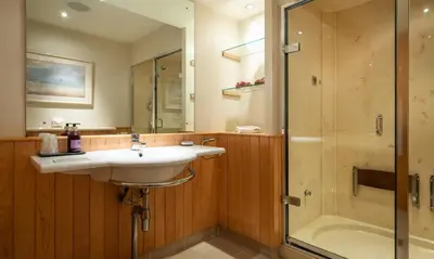 a bathroom with a sink and a shower at Brackenburn in Applethwaite