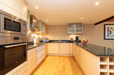 a kitchen with a sink and a stove top oven at Castlerigg in Applethwaite