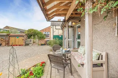 an outdoor patio with a table and chairs at 3 Bed in Kirkbampton oc-l32005 in Burgh by Sands