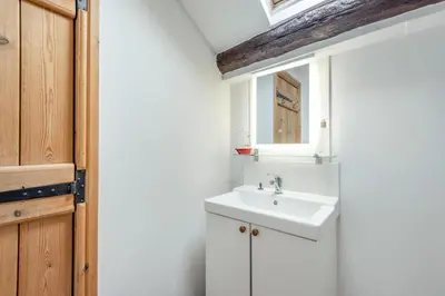 a bathroom with a sink and a mirror at 3 Bed in Kirkbampton oc-l32005 in Burgh by Sands