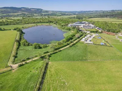 an aerial view of a lake in a field at 3 Bed in Isel oc-o32074 in Sunderland