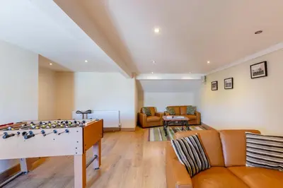 a living room with a foosball table and a couch at 2 Bed in Isel oc-s32076 in Sunderland