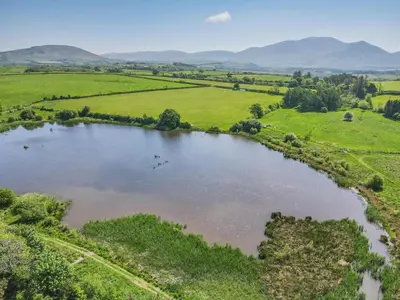 an aerial view of a lake in a field at 2 Bed in Isel oc-s32076 in Sunderland