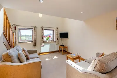 a living room with two couches and a tv at 2 Bed in Isel oc-s32076 in Sunderland