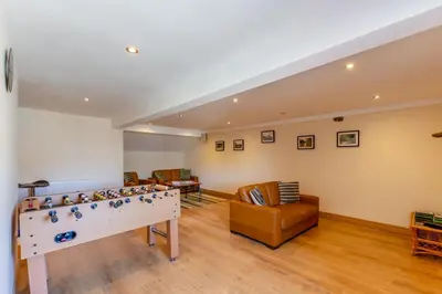 a living room with a foosball table and chairs at 2 Bed in Isel oc-o32077 in Sunderland
