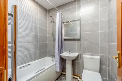 a bathroom with a sink and a toilet and a bath tub at 2 Bed in Isel oc-o32077 in Sunderland