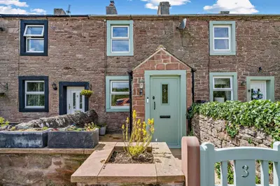 a brick house with a green door at 2 Bed in Rowrah oc-s32232 in Rowrah