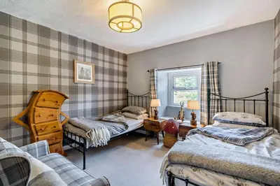 a bedroom with two beds and a couch at 2 Bed in Rowrah oc-s32232 in Rowrah