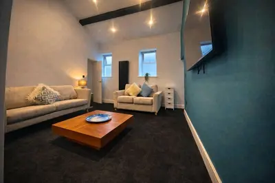 a living room with two couches and a coffee table at The Croft in Ramsey