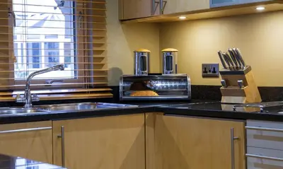 a kitchen with a sink and a stove at Grisedale in Applethwaite