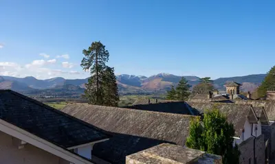 a view of the mountains from the roofs of houses at Grisedale in Applethwaite