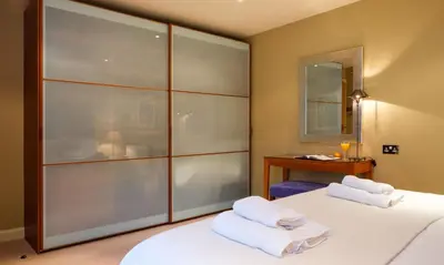 a bedroom with two beds with towels on them at Underscar - Newlands in Keswick