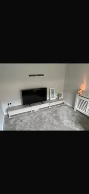 a living room with a flat screen tv at Beautiful modern self-contained house in Moffat