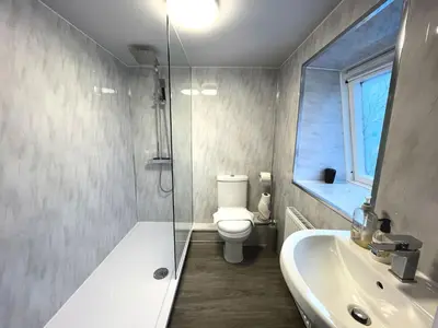 a bathroom with a toilet and a sink and a shower at Cosy Cottage in Moffat Town Centre - Pass the Keys in Moffat