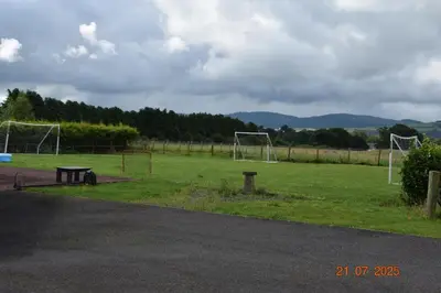 a park with a soccer field withgoalisers at Rural luxury bungalow in Terreglestown