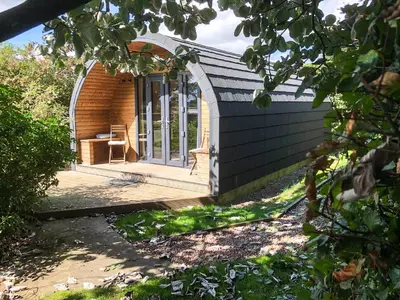 an open door of a house with a porch at The Eden Hideaway - Uk1554 in Rockcliffe