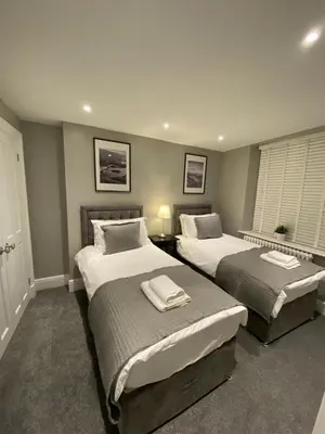 a bedroom with two beds in a room at 26 Challoner Street, Cockermouth, CA13 9QS in Cockermouth