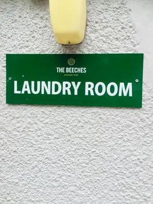 a sign for the beeches laundry room with a candle at 29 The Beeches in Gilcrux