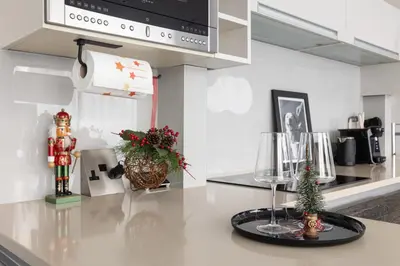a kitchen with a counter with christmas decorations on it at New! Modern Wapping 1BR Flat near Tower Bridge in Moffat