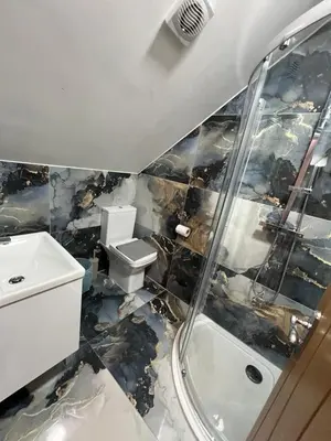 a demolished bathroom with a toilet and a sink at Rest Inn Edmonton in Moffat