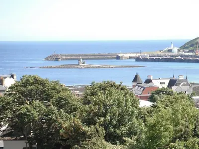 a view of a body of water with a bridge at Arrandale House in Douglas