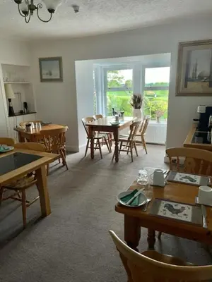 a dining room with a table and chairs at Airds Farm Guest House in Castle Douglas