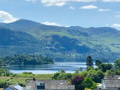 a view of a lake with mountains in the background at Skiddaw Croft Bed & Breakfast in Keswick