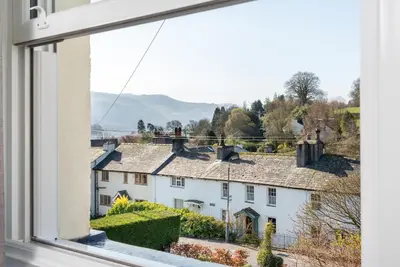 a view from a window of a white house at Skiddaw Croft Bed & Breakfast in Keswick