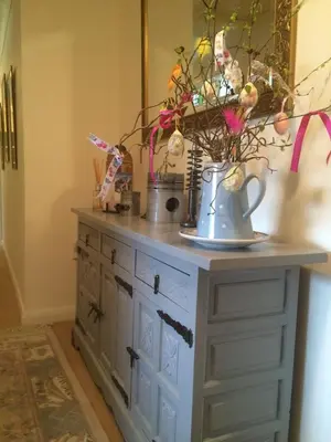 a dresser with two vases on top of it at Ballacowell in Sulby