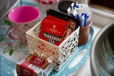 a table with a tray of toothpaste and toothbrushes at Beech House in Greystoke