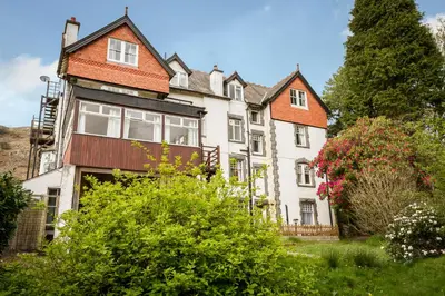 a large white house with an orange roof at Stanley House in Eskdale