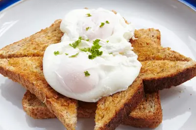 a white plate with a egg on top of toast at Brookfield B&B Guest House in Keswick