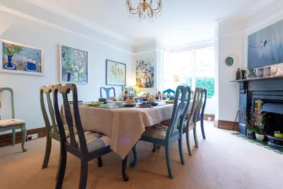 a dining room with a table and chairs at The Mount self-catering in Portinscale
