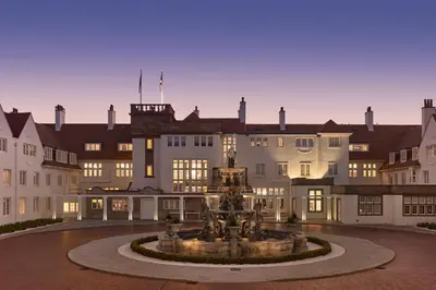 a fountain in a courtyard in front of a building at Trump Turnberry in Turnberry