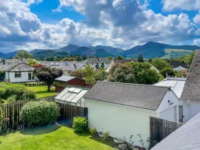 a suburb with houses and mountains in the background at Causey View in Keswick