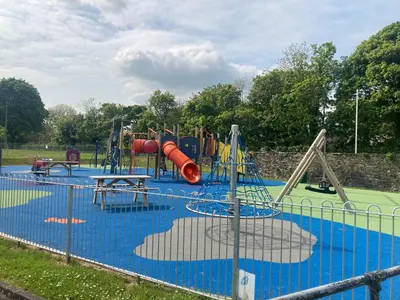 an empty playground with slides and swings at Old Station House - Kilfillan Cottage in Garlieston