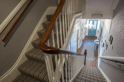 an overhead view of a staircase in a house at Baie Mooar House, Boutique B&B in Ramsey