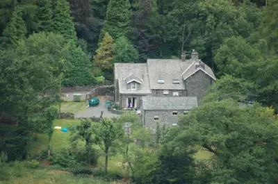 an aerial view of a house in the woods at Old Water View in Patterdale
