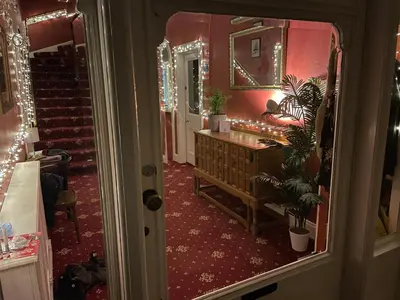 a bathroom with a mirror and a sink in a room at Moffat Independent Hostel in Moffat
