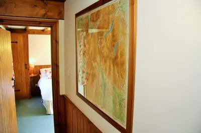 a large painting hanging on a wall in a room at Stable Barn in Penrith