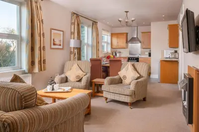 a living room with two chairs and a table at Bannerdale in Penrith