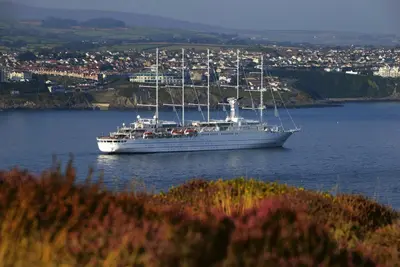 a large white boat in a large body of water at The Penta in Douglas