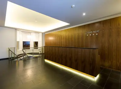 a lobby with a sign on a wooden wall at Claremont Hotel in Douglas
