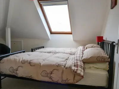 a bed in a room with a window at Crossfeld in Keswick