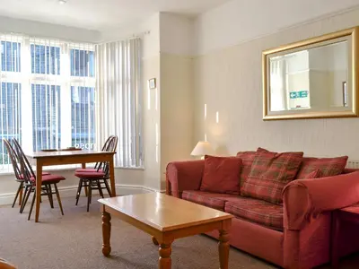 a living room with a couch and a table at Skiddaw in Keswick