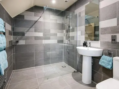 a bathroom with a shower and a sink and a toilet at Knocktinkle in Gatehouse of Fleet