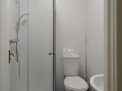 a bathroom with a toilet and a sink at Blaithwaite Stables in Blencogo