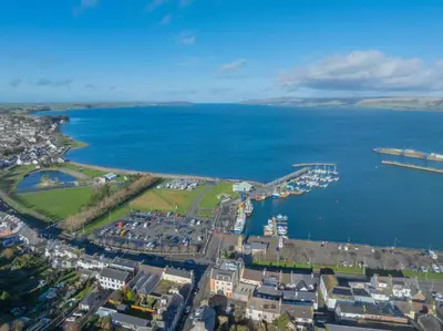 an aerial view of a city and a body of water at Quay Head View Aparthotel in Stranraer